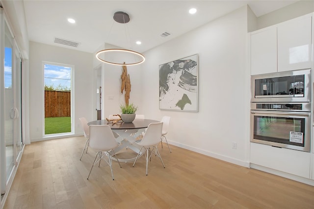 unfurnished dining area with light hardwood / wood-style floors