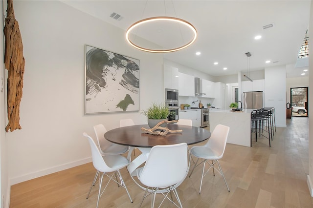 dining room featuring light hardwood / wood-style floors