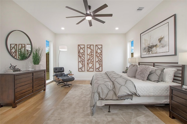 bedroom with light wood-type flooring and ceiling fan