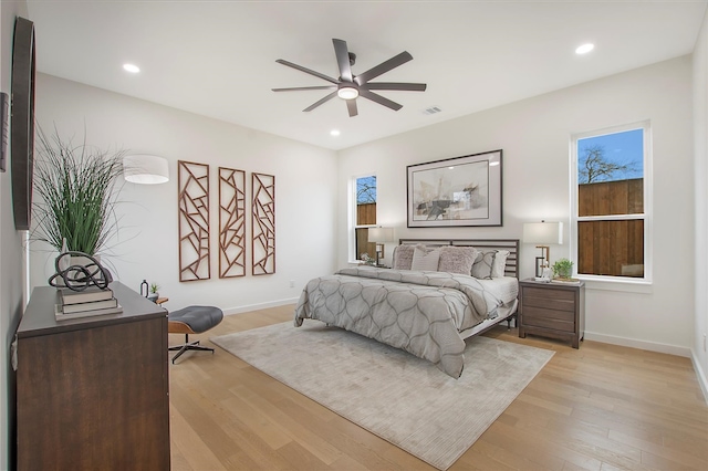 bedroom featuring light hardwood / wood-style flooring and ceiling fan