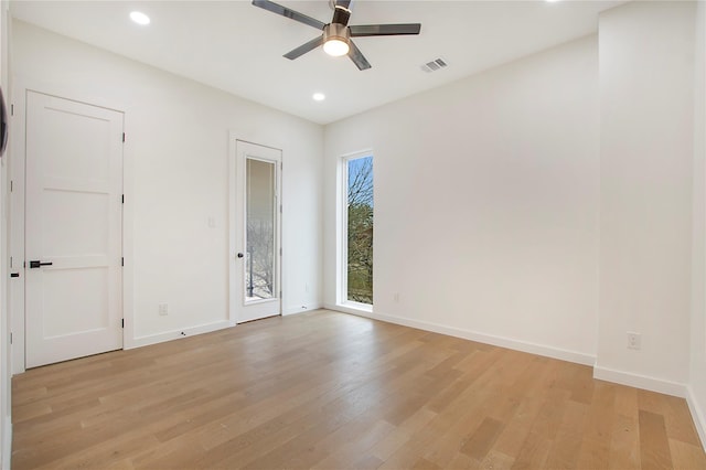 spare room with ceiling fan and light hardwood / wood-style flooring