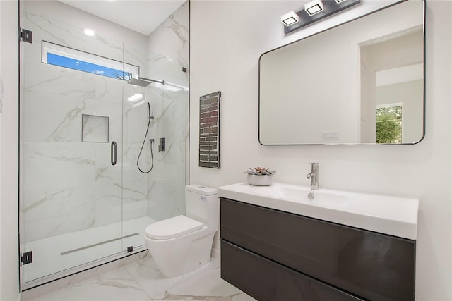 bathroom with vanity, toilet, and an enclosed shower