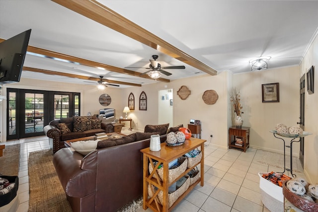 living room featuring french doors, ceiling fan, beam ceiling, ornamental molding, and light tile patterned floors