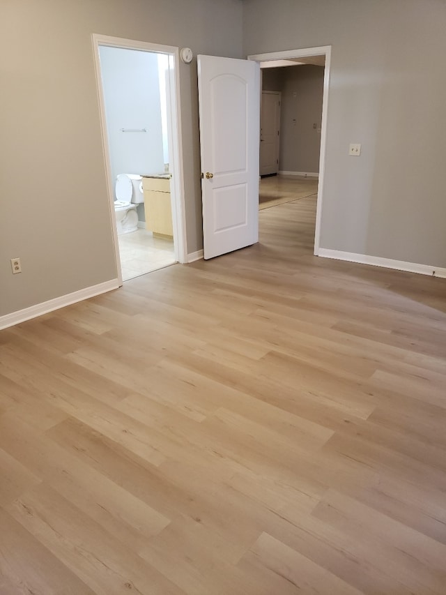 unfurnished room with light hardwood / wood-style flooring