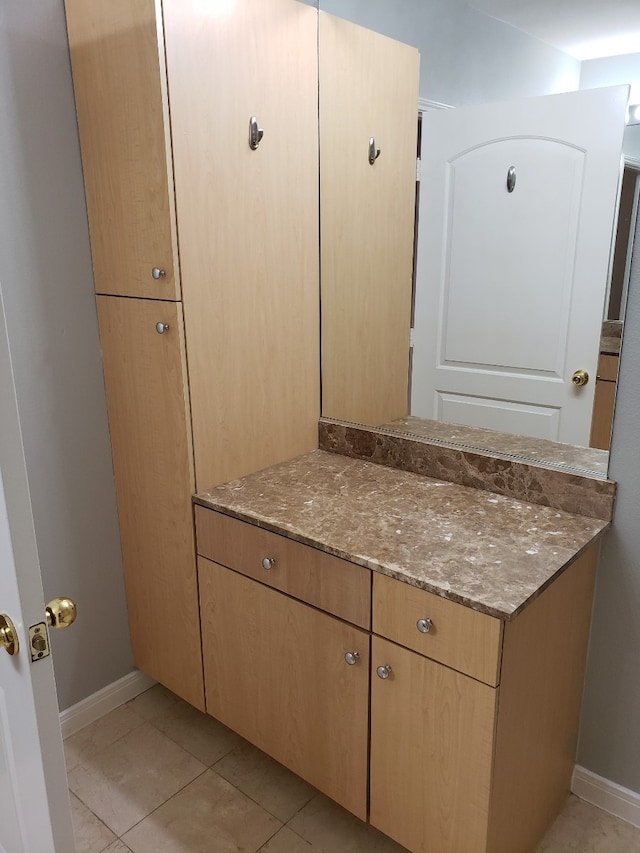 bathroom featuring vanity and tile patterned flooring