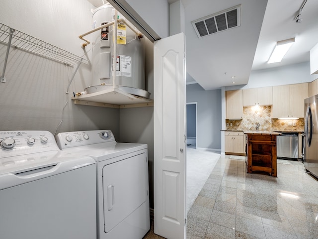 clothes washing area featuring washing machine and dryer