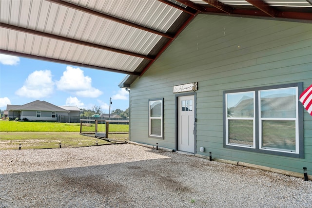 property entrance with a yard