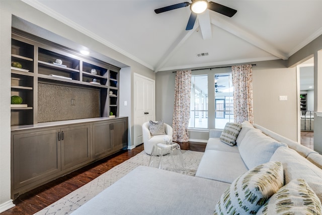 living room with ornamental molding, dark wood-type flooring, vaulted ceiling with beams, and ceiling fan