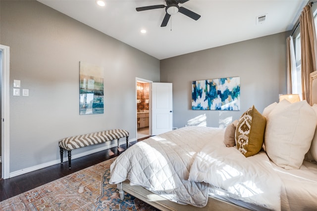 bedroom with connected bathroom, ceiling fan, and dark hardwood / wood-style flooring