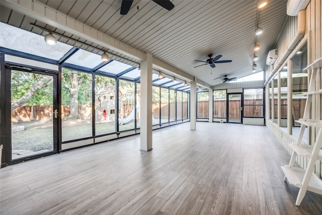 unfurnished sunroom featuring wooden ceiling and lofted ceiling