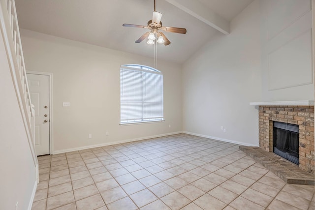 unfurnished living room with a brick fireplace, lofted ceiling with beams, ceiling fan, and light tile patterned floors