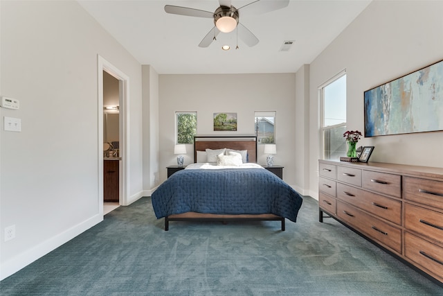 carpeted bedroom with connected bathroom and ceiling fan