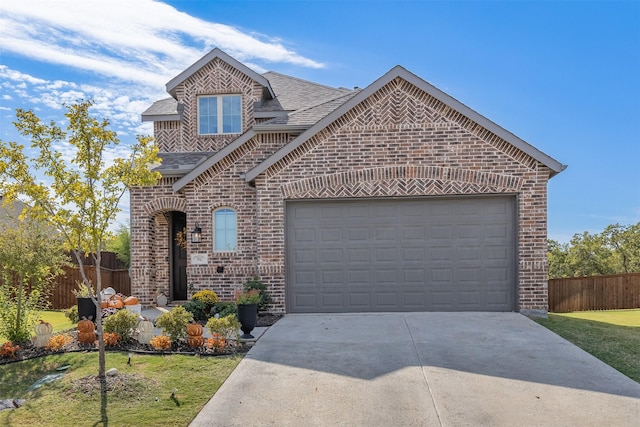 front facade with a front lawn and a garage