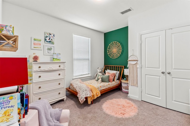 bedroom featuring a closet and carpet