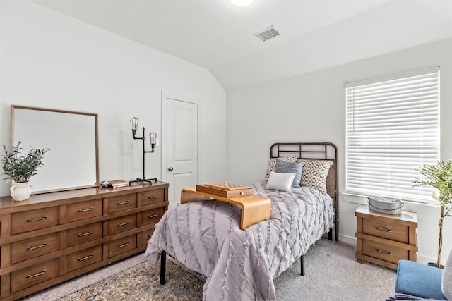 carpeted bedroom featuring lofted ceiling