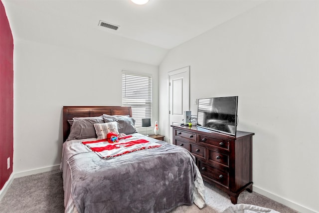 bedroom featuring carpet floors and vaulted ceiling