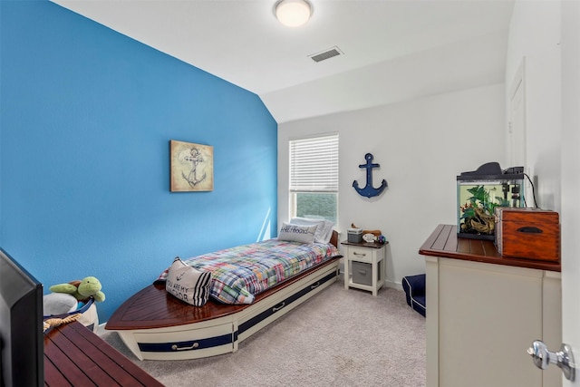 bedroom featuring light colored carpet and vaulted ceiling