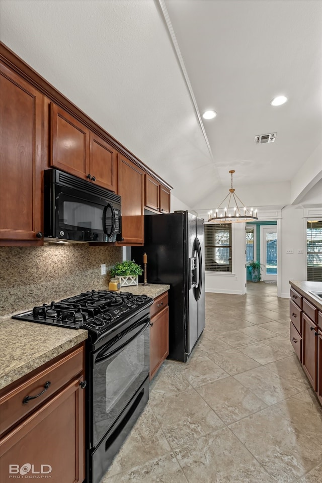 kitchen featuring lofted ceiling, decorative backsplash, black appliances, decorative light fixtures, and a chandelier