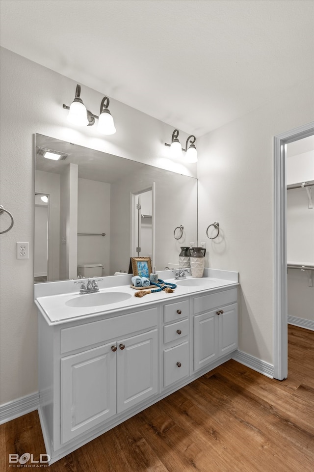 bathroom featuring vanity and wood-type flooring