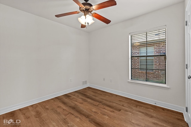 unfurnished room featuring hardwood / wood-style flooring and ceiling fan