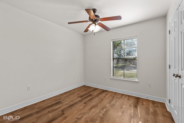 unfurnished room with hardwood / wood-style flooring and ceiling fan