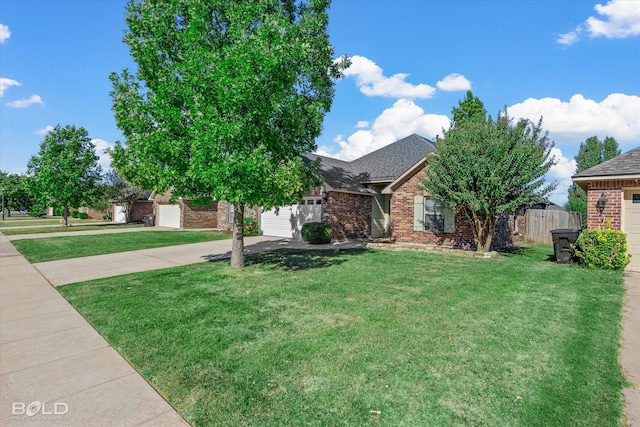 view of front of home featuring a garage and a front lawn