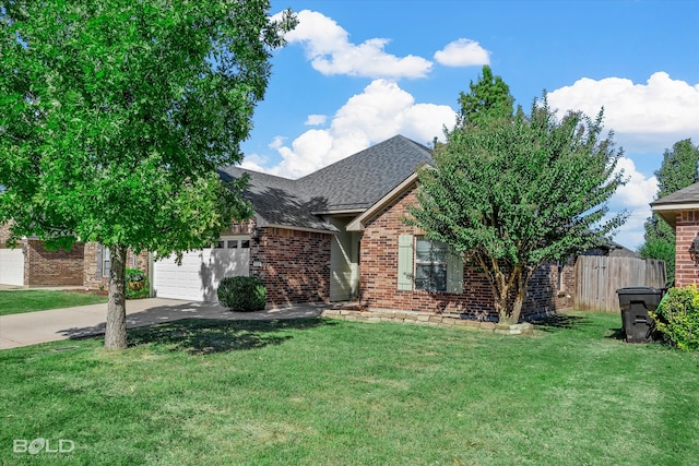 view of front facade with a garage and a front lawn