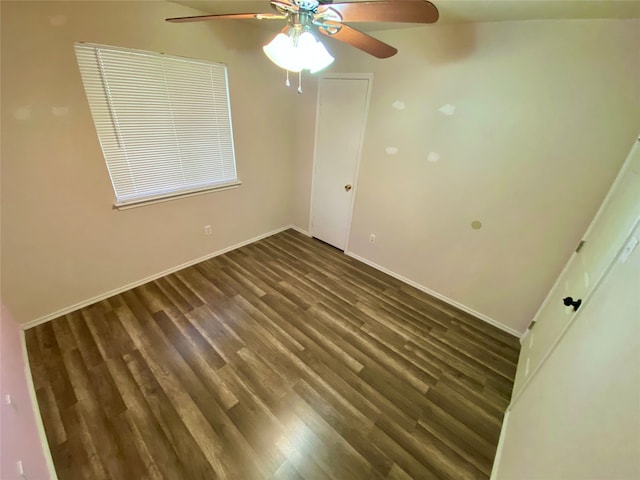 unfurnished bedroom with ceiling fan and dark hardwood / wood-style flooring