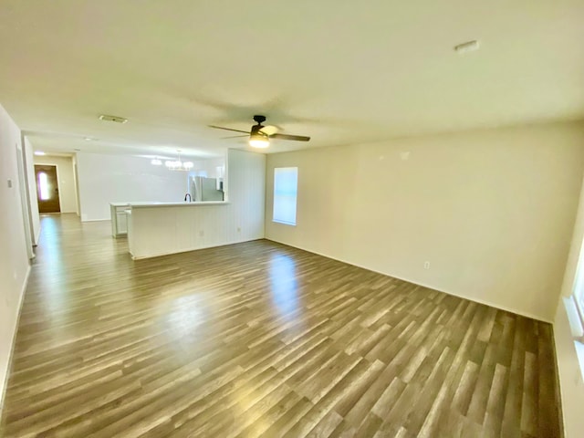 spare room featuring ceiling fan and hardwood / wood-style flooring