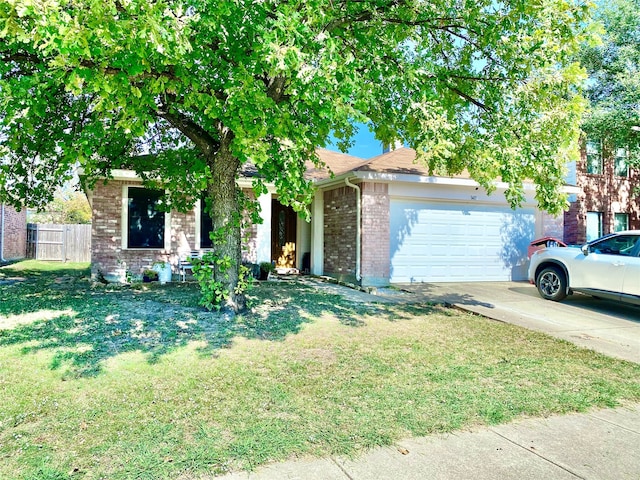 obstructed view of property featuring a front yard and a garage