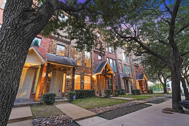 view of front of house with a yard