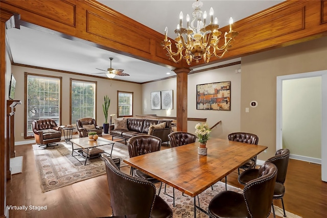 dining room with ceiling fan with notable chandelier, ornate columns, a wealth of natural light, and crown molding