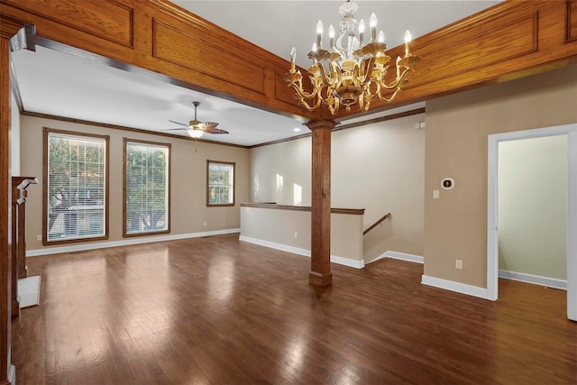 unfurnished living room featuring ceiling fan with notable chandelier, a wealth of natural light, and ornamental molding