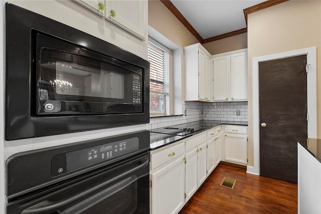 kitchen featuring white cabinetry, black appliances, and ornamental molding