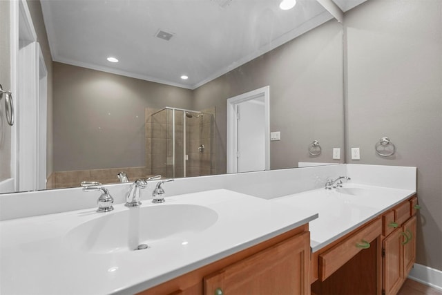 bathroom featuring vanity, crown molding, and walk in shower