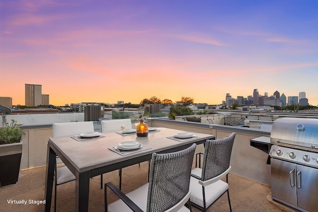 patio terrace at dusk with area for grilling