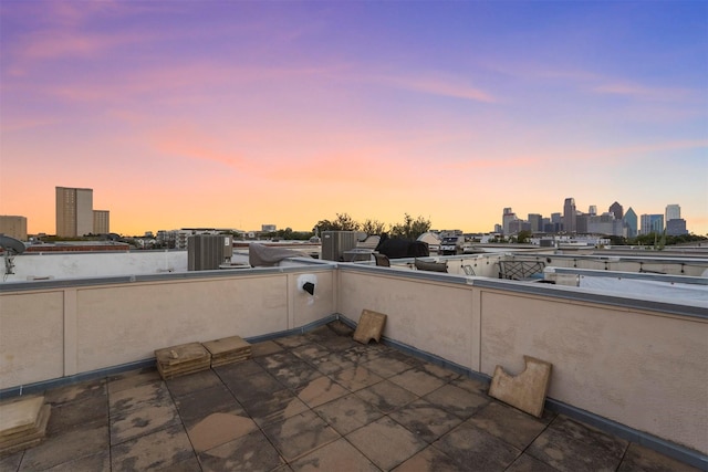 view of patio terrace at dusk