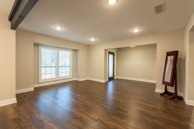 empty room featuring dark hardwood / wood-style floors