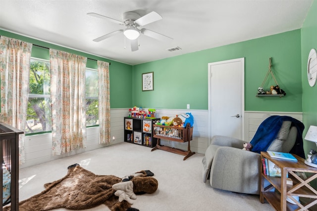 interior space with ceiling fan and carpet floors