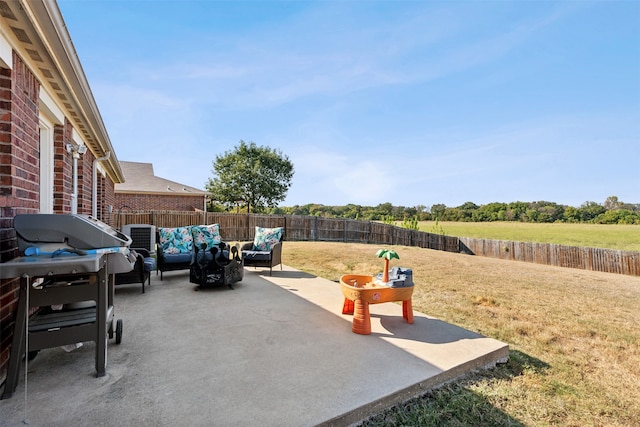 view of patio / terrace with outdoor lounge area and a grill