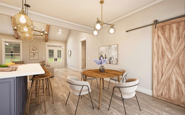 dining room with french doors, vaulted ceiling, light hardwood / wood-style flooring, and a barn door