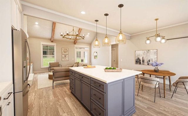 kitchen featuring wooden ceiling, stainless steel fridge, decorative light fixtures, white cabinetry, and light hardwood / wood-style floors