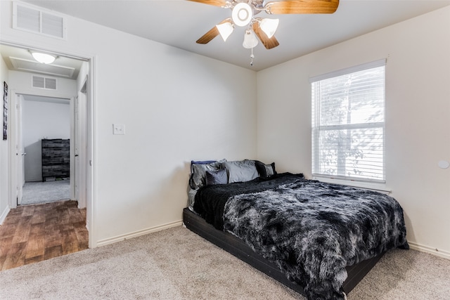 carpeted bedroom featuring ceiling fan