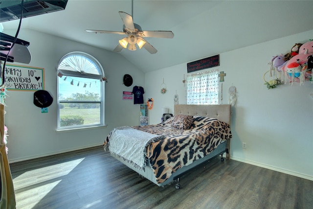 bedroom with ceiling fan, dark hardwood / wood-style floors, and vaulted ceiling