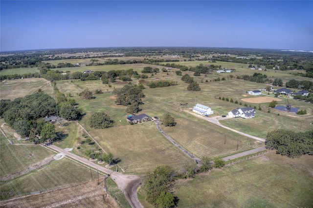 birds eye view of property featuring a rural view