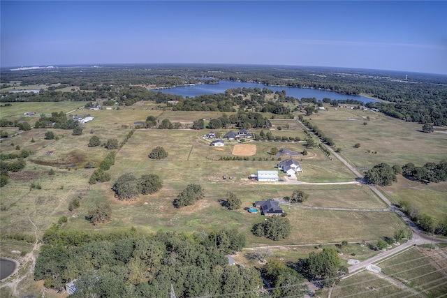 drone / aerial view featuring a water view and a rural view