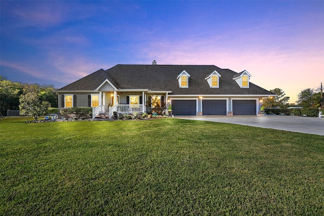 cape cod home with a lawn, a porch, and a garage