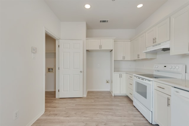 kitchen with white cabinets, light wood-type flooring, and white appliances