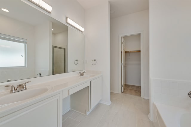 bathroom with vanity, separate shower and tub, and tile patterned flooring