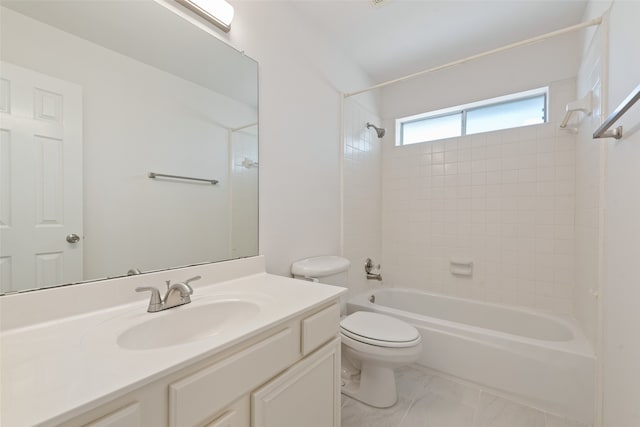 full bathroom with toilet, tiled shower / bath combo, and vanity